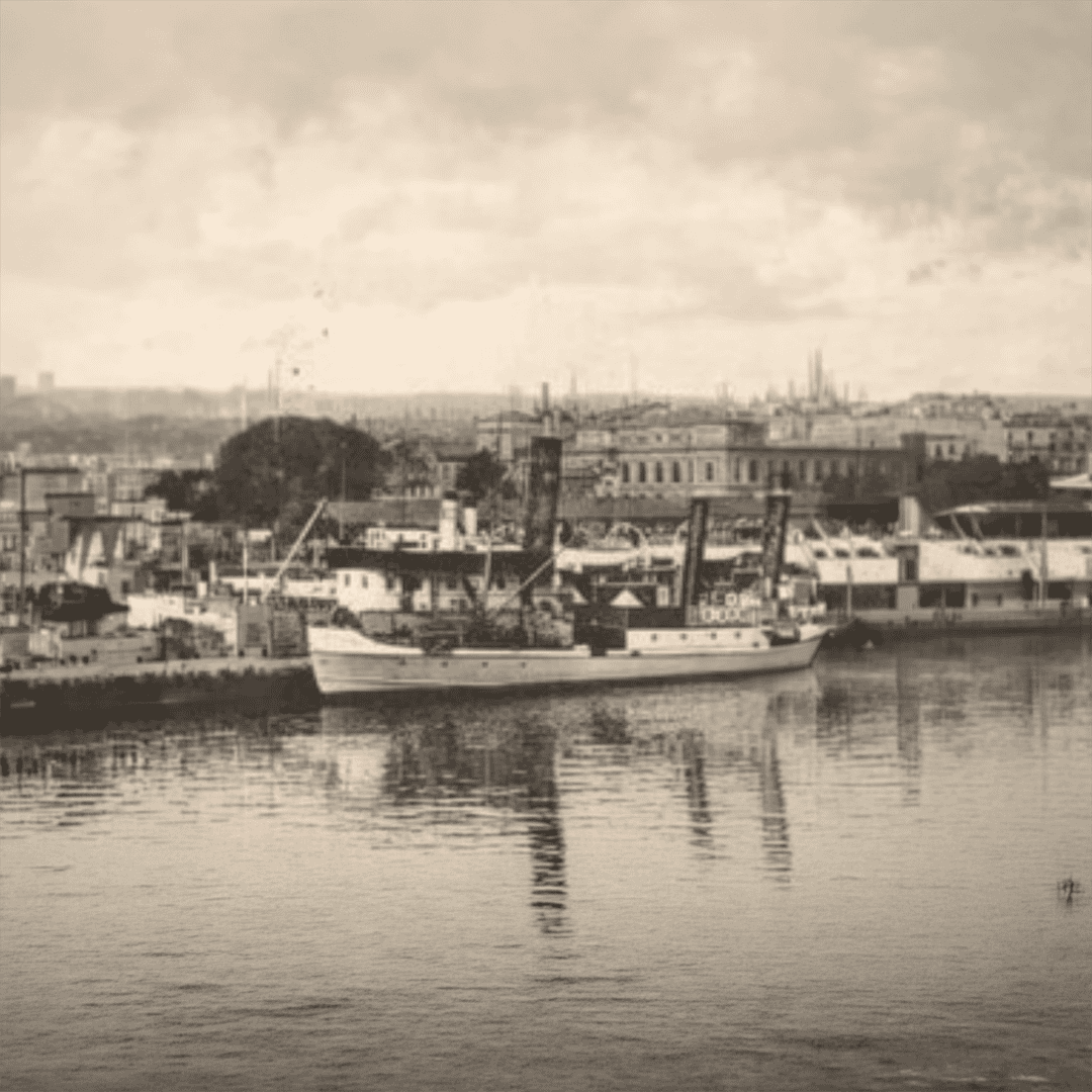 Historical archival photo of a vintage steamship at a Norwegian harbor terminal, representing the founding of Christiania Reeperbahne.